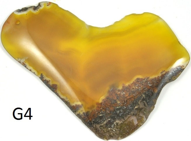 Large Agate gemstone each with a unique shape and colour. Each is polished and dome shaped . Use as a pendant focal bead ,  8  available